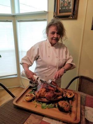 Joanne carving the aged balsamic vinegar & honey glazed turkey with apple stuffed acorn squash side