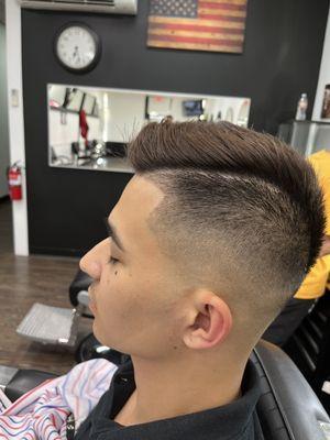 Mid skin fade with part line