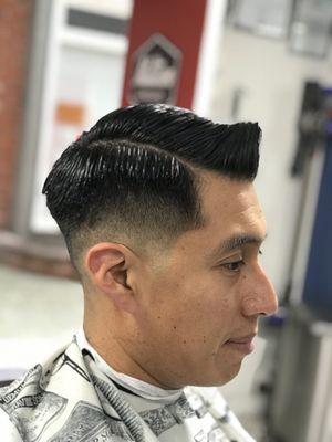 Low fade with a side part