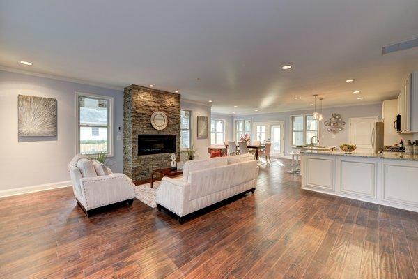 Custom slate stone gas fireplace with burnished acacia hardwood floors...gorgeous!