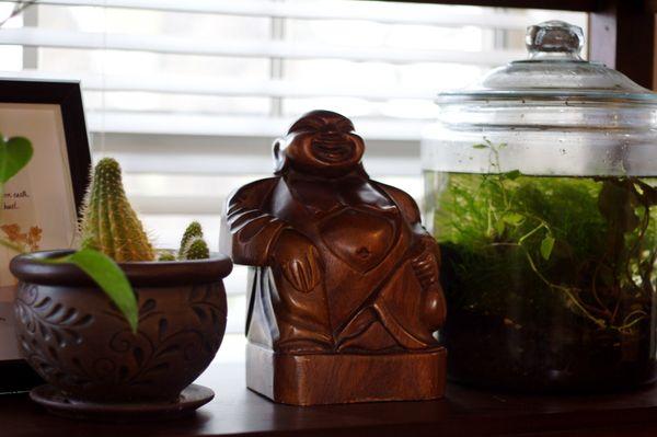 A sweet buddha next to some sweet fishies welcome you!