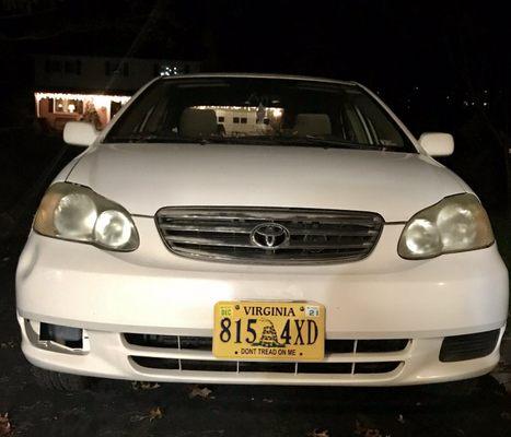 BEFORE: 2003 Toyota Corolla with dingy headlights and empty fog light socket.