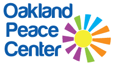 Text: Oakland Peace Center 
 Graphic: A multicolored sun or flower