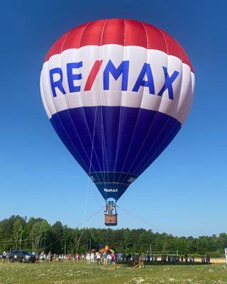 The big RE/MAX hot air balloon at Louisburg Charter School during a demonstration for the students.