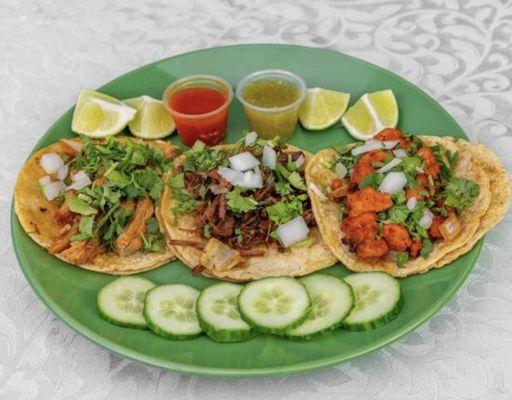 Taqueria Yolandita's Traditional Tacos with Onion, Cilantro, Lime, Cucumber & salsa on the side!