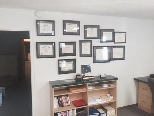 Bob's wall of professional licenses and certificates.  You get more than you pay for our office.