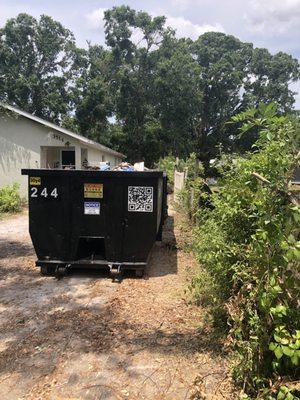 30yd dumpster in use on an abandoned house