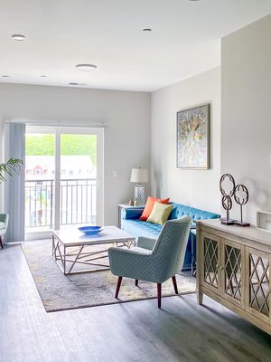 Spacious living room with wide plank flooring