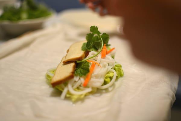 A spring roll being assembled during our cooking lesson