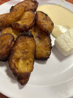 Sweet fried plantains with crema.  Queso blanco