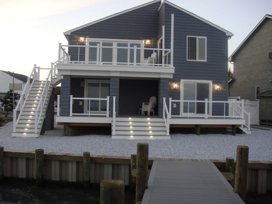 custom decks and railings with new windows doors and siding at Beach haven