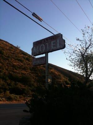 The cool old motel sign in front of the Pelona Motel