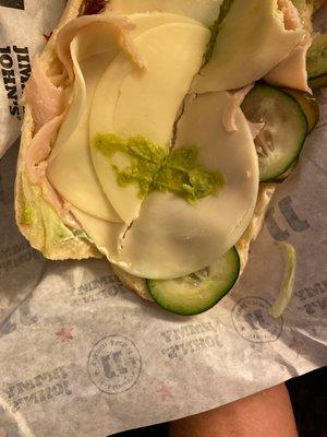 Here's my one dollop of guac. And I have one layer of turkey in my sandwich.