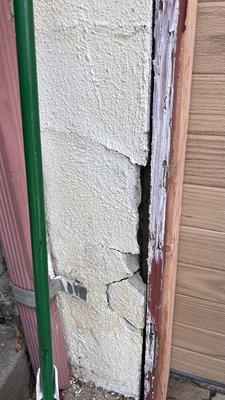 Broken stucco, old rotten trim