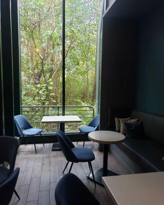 Lounge area in the hotel next to a Starbucks inside.