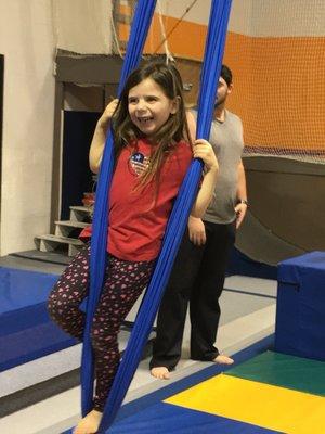 My daughter swinging from a silk rope. She had a blast!