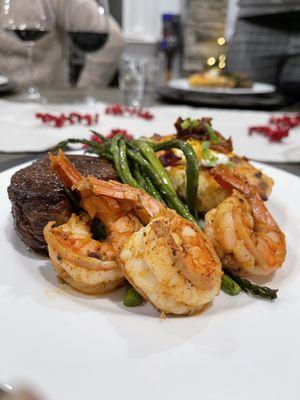 Filet Mignon with shrimp, asparagus, and twice baked potatoes.