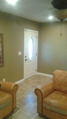 Tile flooring,  new baseboards and replaced the front entry door.