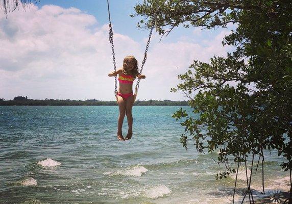 Swinging on a swing at one of the spoil islands