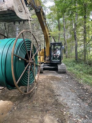 Chris installing fiber conduit