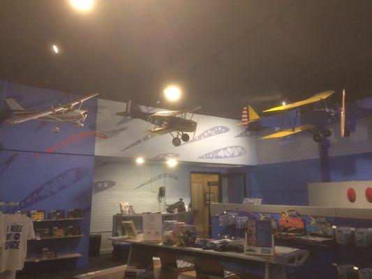 Planes hanging from the ceiling of the gift shop