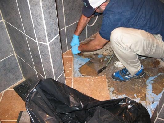 Brent working on a shower floor.