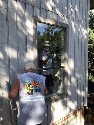 Steve and one of his workers installing the master bathroom window together.