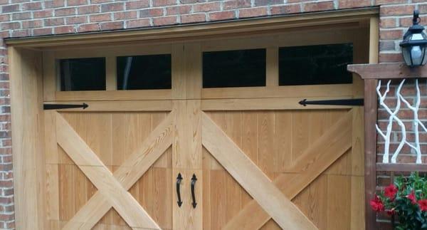 Single car garage wooden door with glass windows