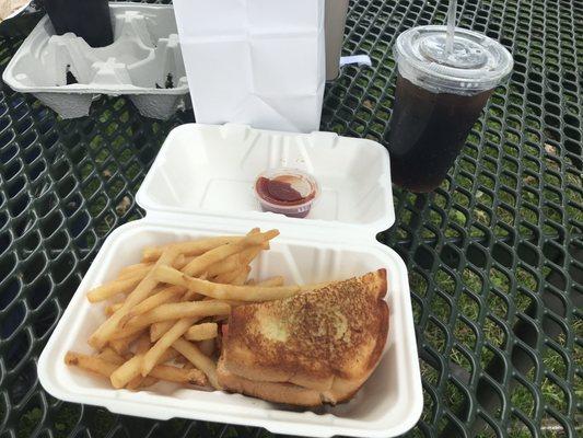 Pesto grilled cheese with fries and Pepsi