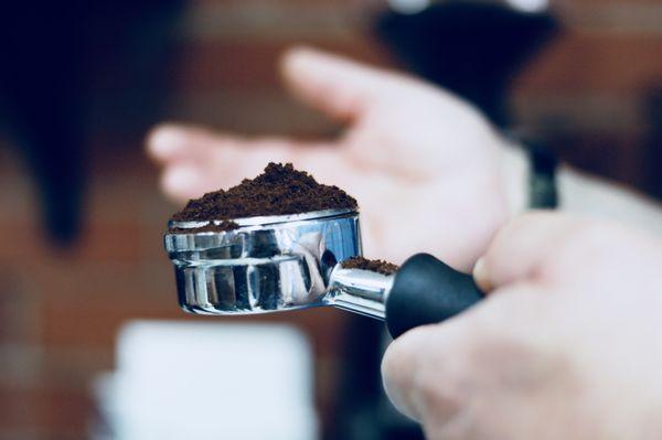 Finely ground coffee in a portafilter for espresso