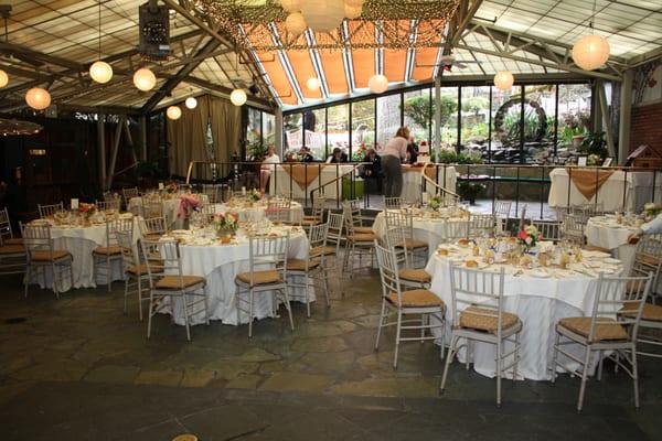 Dining/reception area. "Waterwheel Stage" can be used for head table, live band, cocktail hour, dancing, cake table