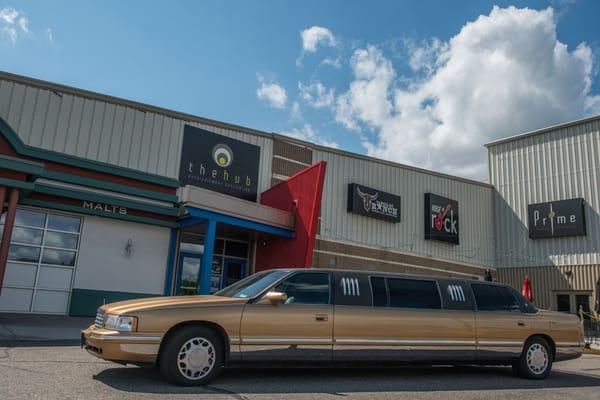 The limo in front of Sickies Garage and The Hub.