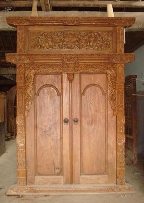 a hand-carved solid teak door