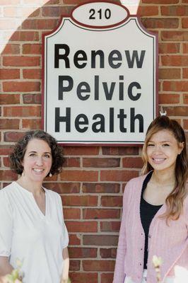 Dr Amanda Shipley & Dr Ariel Esperancilla in front of the Renew Pelvic Health sign at our office in Decatur, GA (with free parking!).