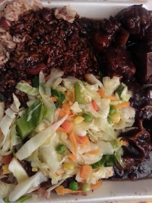 Ox tails with rice and peas and steamed vegetables was prepared by B & R Spice Jamaican Restaurant 11/28/2014.