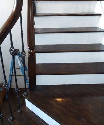 Stained spiral stairs with a elegant white semi gloss trimming