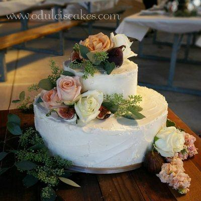 Rustic wedding cake with fresh fruit and flowers!