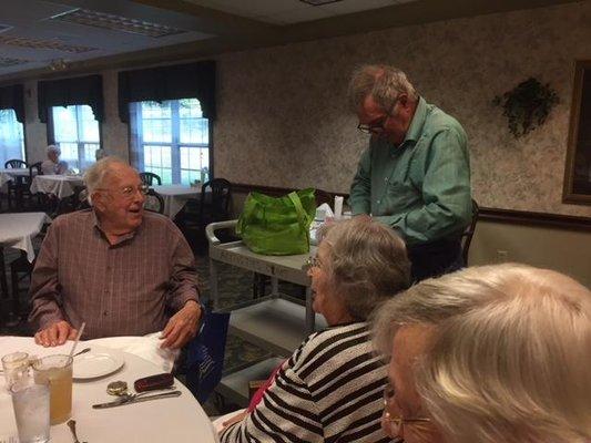 Entertaining Senior citizens with balloon twisting and illusions.