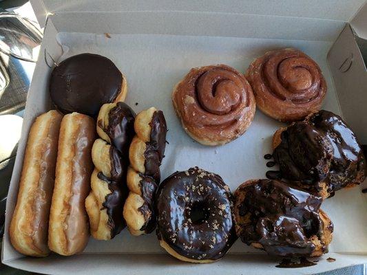 pictures 2 maple bars 2 chocolate twists 2 fresh glazed buttermilk one chocolate raised with cinnamon sprikle 2 mini glazed cinnamon buns