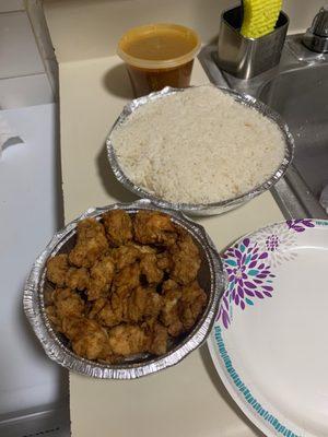 White rice , bean n breaded chicken chunks .... the rice was Smokey n they hardly give u much chicken this meal was $19