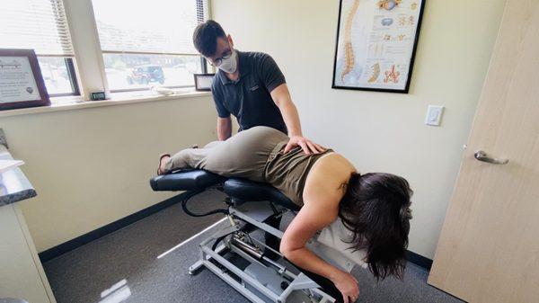 Dr. Kyle Bastean doing Flexion Distraction on patient at MVP Chiropractic and Physical Therapy in New Lenox