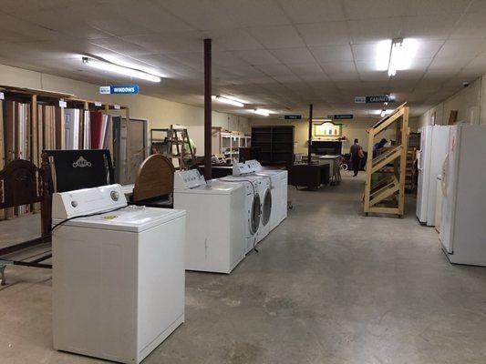 Appliances, doors, plumbing, paint, cabinets and other construction type items in the back room