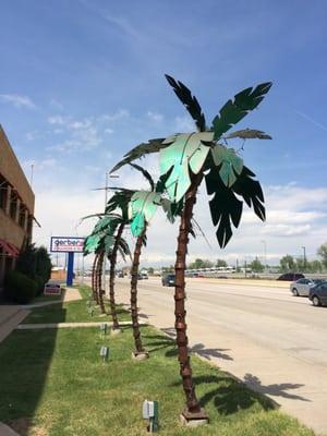 Metal palm trees along S. Santa Fe Dr. to welcome customers to our custom sheet metal shop!