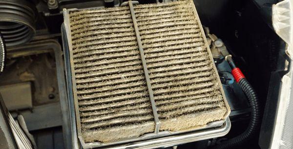 A clogged air filter restricts air flow to the engine causing the engine to work harder.