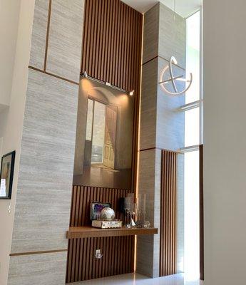 Check out this beautiful foyer entry panelling and console.
 Designer: Tamara Feldman