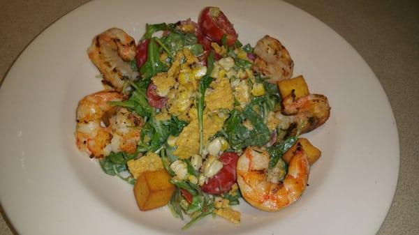 Baby arugula, grilled wild shrimp, petite tomato, polenta croutons, parmesan crisp, sweet corn, garlic vinaigrette