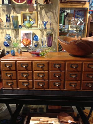 A magnificent large Cherry Burl Bowl on an antique 18 drawer Library Catalogue surrounded by a some of our exciting collection.