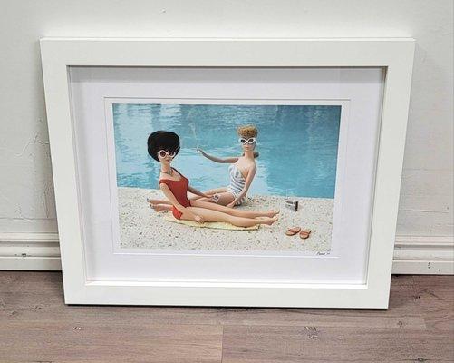 Two girlfriends by the pool smoking and relaxing. Girlfriends deserve a getaway, too. Paired with a pure white mat and off white frame.