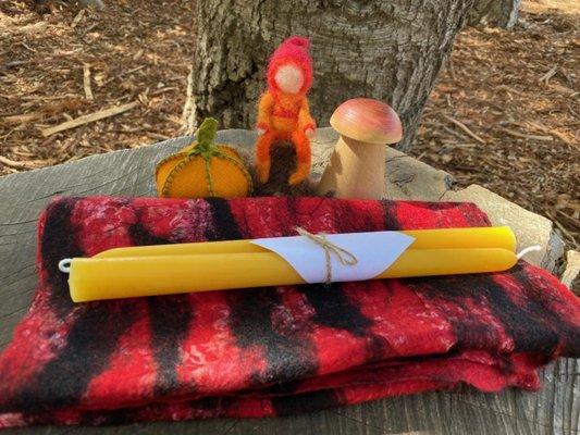 Locally made beeswax tapers by Susan Cook.  Felted gnome and pumpkin bean bag by Joya Birns.  Wooden redwood mushroom by Carl Atilano.