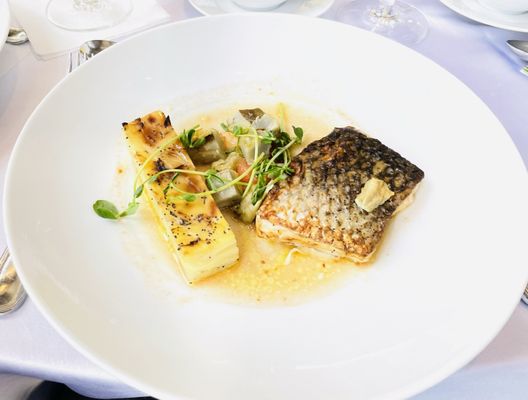 Atlantic Sea Bass Artichoke Hearts, Poppyseed Potato Terrine, Pea shoot Salad & Tomato Vinaigrette